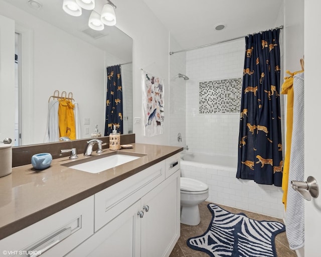 1931 W Barry Ave, Chicago, IL 60657 - bathroom featuring tiled shower / bath, vanity, toilet, and tile patterned flooring