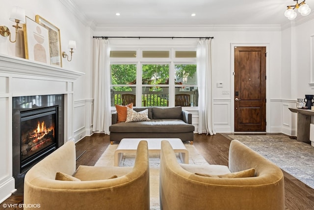 1931 W Barry Ave, Chicago, IL 60657 - living area featuring a decorative wall, a glass covered fireplace, crown molding, wood finished floors, and wainscoting