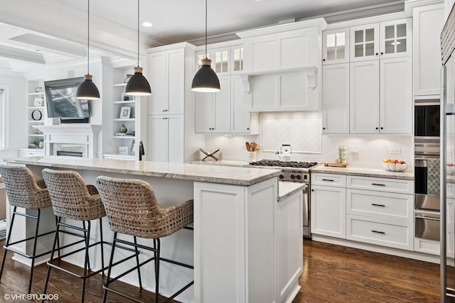 1931 W Barry Ave, Chicago, IL 60657 - kitchen featuring white cabinetry, a warming drawer, glass insert cabinets, a center island, and recessed lighting