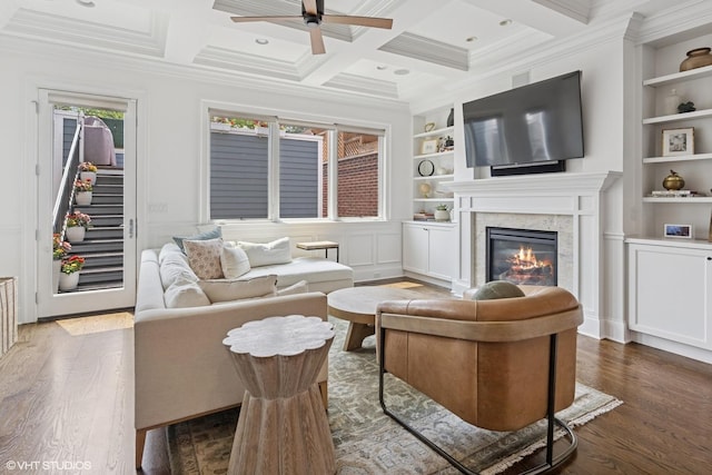 1931 W Barry Ave, Chicago, IL 60657 - living room featuring built in shelves, wood finished floors, ceiling fan, a high end fireplace, and beamed ceiling