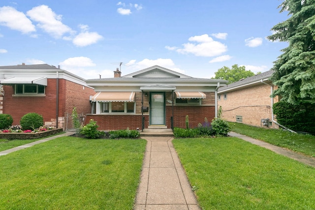 2317 Forest Ave, North Riverside, IL 60546 - view of front of property featuring a front lawn, brick siding, and a chimney