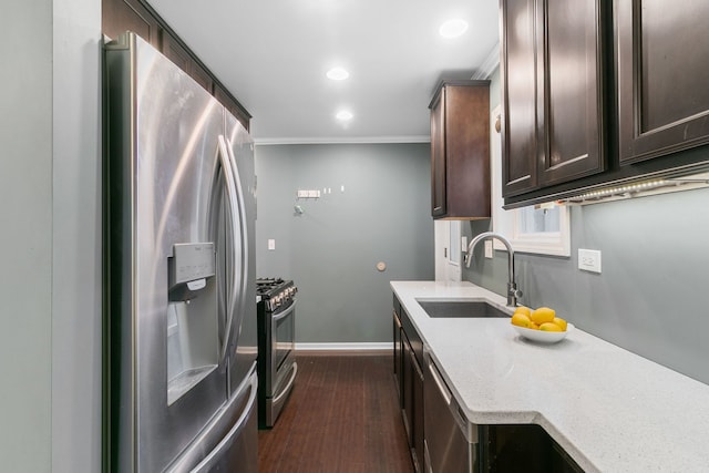2317 Forest Ave, North Riverside, IL 60546 - kitchen with stainless steel appliances, a sink, dark brown cabinets, dark wood-type flooring, and ornamental molding