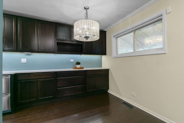 2317 Forest Ave, North Riverside, IL 60546 - kitchen with a chandelier, ornamental molding, light countertops, dark wood-type flooring, and pendant lighting