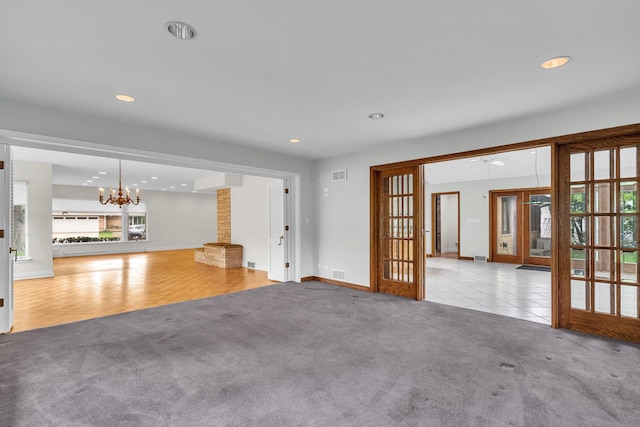 6801 N Lexington Ln, Niles, IL 60714 - unfurnished living room with french doors, carpet flooring, a chandelier, recessed lighting, and baseboards