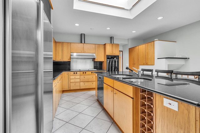6801 N Lexington Ln, Niles, IL 60714 - kitchen with black appliances, under cabinet range hood, light tile patterned floors, a sink, and recessed lighting