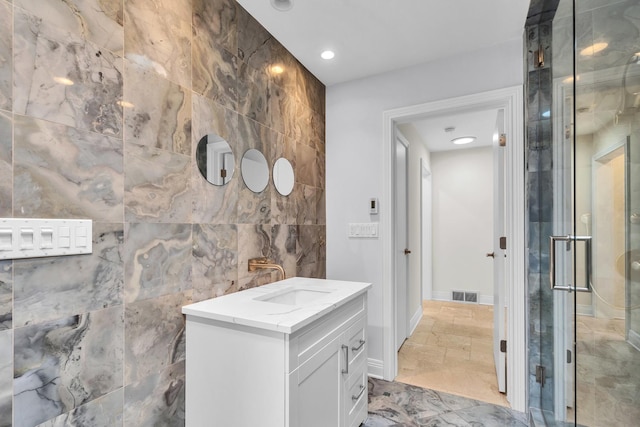 6801 N Lexington Ln, Niles, IL 60714 - bathroom with tile walls, vanity, a stall shower, marble finish flooring, and recessed lighting