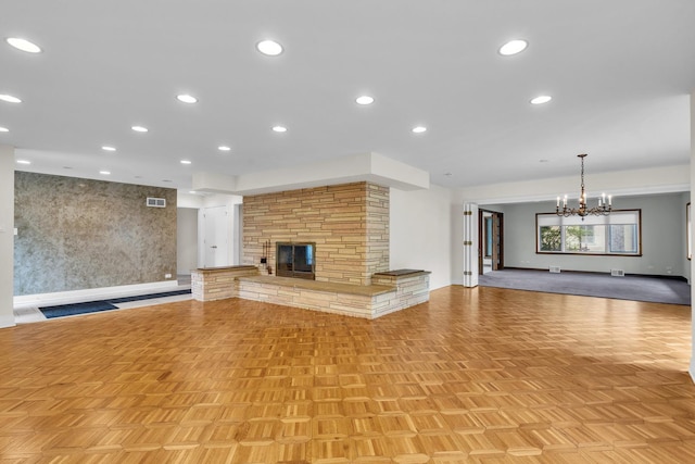 6801 N Lexington Ln, Niles, IL 60714 - unfurnished living room with a stone fireplace, a chandelier, and recessed lighting