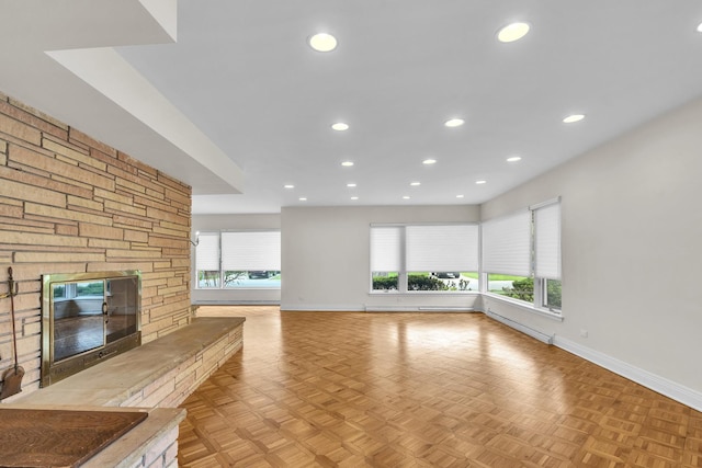 6801 N Lexington Ln, Niles, IL 60714 - unfurnished living room featuring baseboards, a stone fireplace, plenty of natural light, and recessed lighting