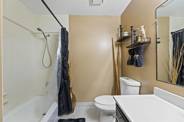 bathroom featuring shower / bath combination with curtain, toilet, vanity, and baseboards