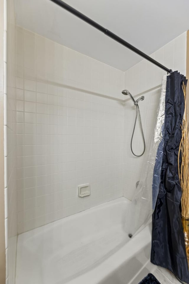 full bathroom featuring shower / bathtub combination with curtain
