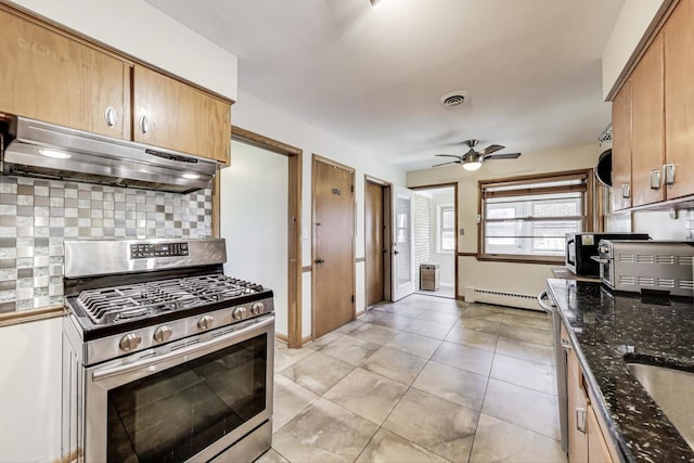 929 N Delphia Ave, Park Ridge, IL 60068 - kitchen with stainless steel range with gas cooktop, under cabinet range hood, baseboard heating, a ceiling fan, and backsplash