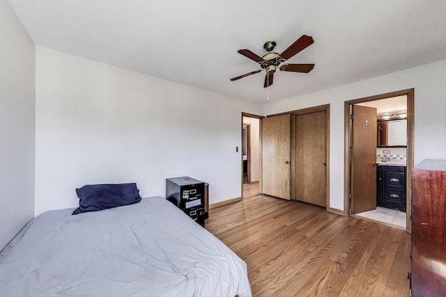 929 N Delphia Ave, Park Ridge, IL 60068 - bedroom with light wood-style floors, ensuite bathroom, a ceiling fan, a closet, and baseboards