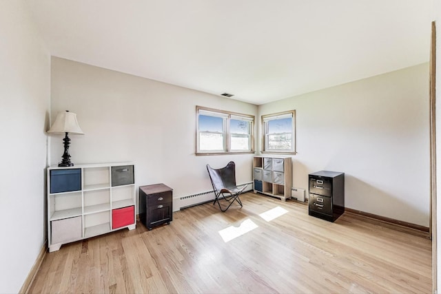 929 N Delphia Ave, Park Ridge, IL 60068 - sitting room with a baseboard heating unit, light wood-type flooring, and baseboards
