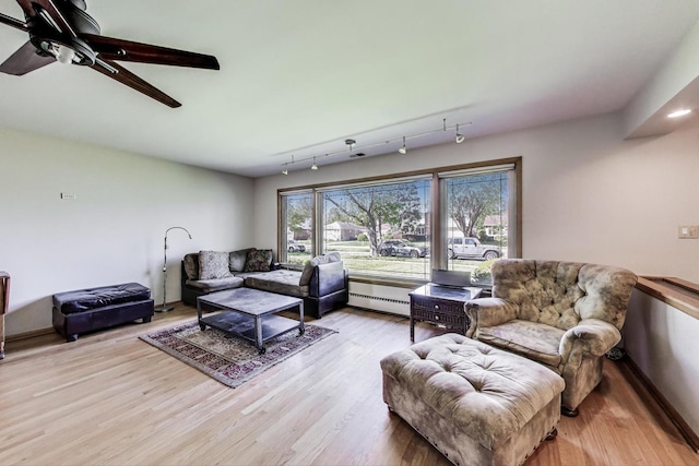 929 N Delphia Ave, Park Ridge, IL 60068 - living area featuring a baseboard radiator, light wood-type flooring, and a ceiling fan