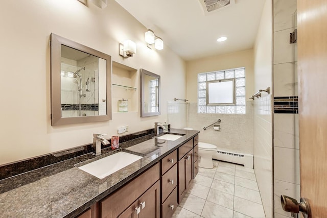 929 N Delphia Ave, Park Ridge, IL 60068 - bathroom featuring a baseboard radiator, a tile shower, toilet, marble look tiles, and double vanity