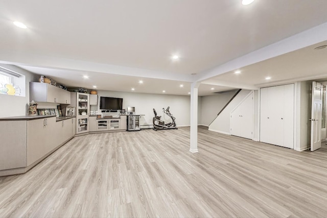 929 N Delphia Ave, Park Ridge, IL 60068 - unfurnished living room with light wood-type flooring, stairway, recessed lighting, and a baseboard heating unit