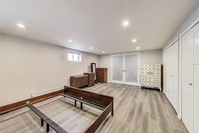 929 N Delphia Ave, Park Ridge, IL 60068 - bedroom with light wood-type flooring, a baseboard heating unit, multiple closets, and recessed lighting