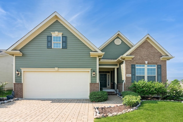 3815 Ridge Pointe Dr, Geneva, IL 60134 - view of front of property featuring brick siding, decorative driveway, and a front yard