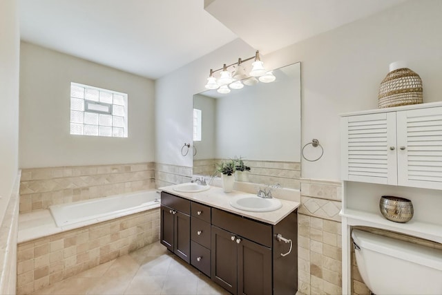 2303 W Chicago Ave Unit 2, Chicago, IL 60622 - full bathroom featuring tile patterned floors, double vanity, a bath, and toilet