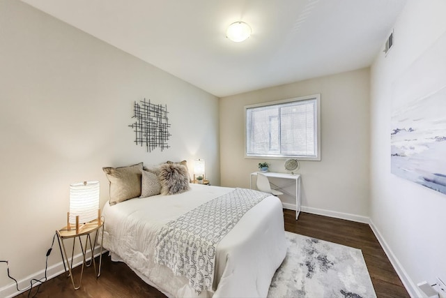 2303 W Chicago Ave Unit 2, Chicago, IL 60622 - bedroom with wood finished floors, baseboards, and a baseboard heating unit