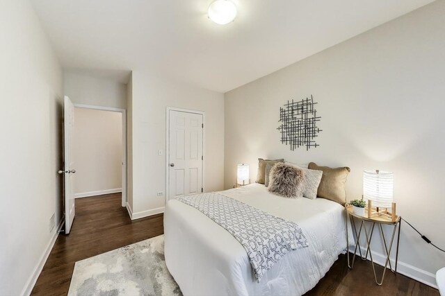2303 W Chicago Ave Unit 2, Chicago, IL 60622 - bedroom featuring dark wood-type flooring and baseboards