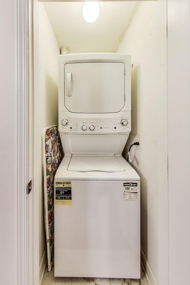 2303 W Chicago Ave Unit 2, Chicago, IL 60622 - laundry room featuring stacked washing machine and dryer