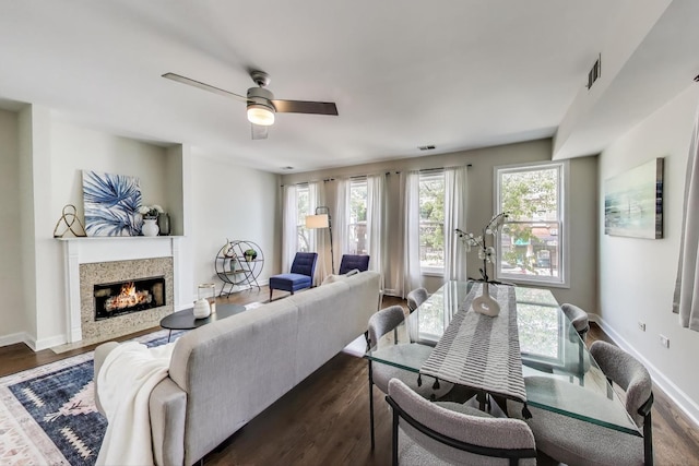 2303 W Chicago Ave Unit 2, Chicago, IL 60622 - living area with dark wood finished floors, a lit fireplace, a ceiling fan, and baseboards