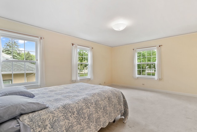 317 Blackhawk Rd, Riverside, IL 60546 - bedroom featuring multiple windows, light colored carpet, and baseboards