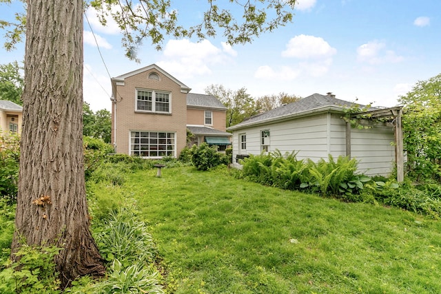 317 Blackhawk Rd, Riverside, IL 60546 - back of house featuring a yard and brick siding