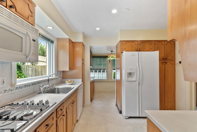 317 Blackhawk Rd, Riverside, IL 60546 - kitchen with white appliances, a sink, light countertops, recessed lighting, and brown cabinets
