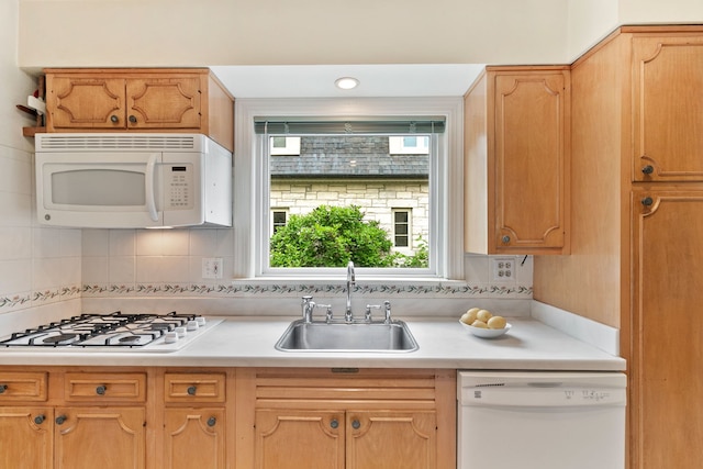 317 Blackhawk Rd, Riverside, IL 60546 - kitchen with white appliances, a sink, light countertops, and tasteful backsplash