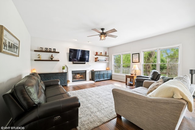39W326 W Mallory Dr, Geneva, IL 60134 - living room featuring a ceiling fan, a warm lit fireplace, and wood finished floors