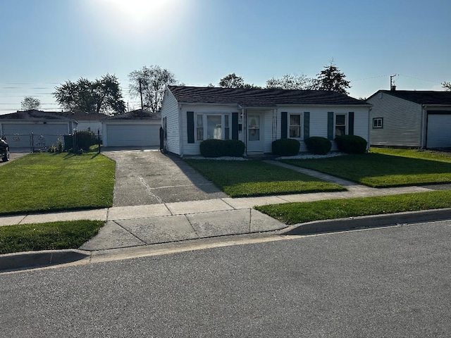 411 Kenyon Ave, Romeoville, IL 60446 - ranch-style home with a front lawn and a detached garage