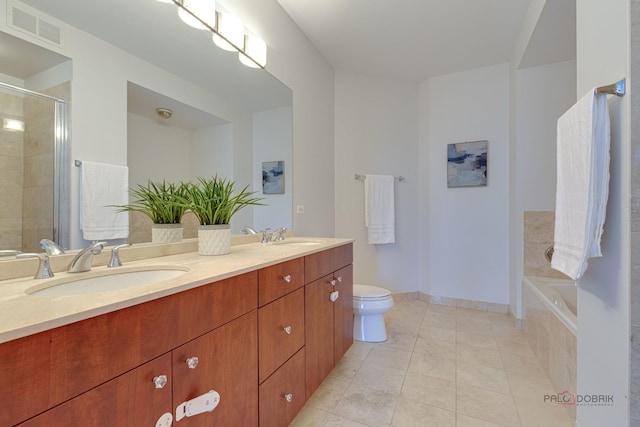 565 W Quincy St Unit 1206, Chicago, IL 60661 - bathroom featuring tile patterned flooring, a tile shower, double vanity, toilet, and baseboards