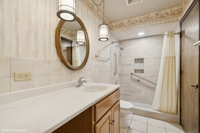 1092 Aberdeen Ln, Mundelein, IL 60060 - full bathroom featuring toilet, a stall shower, vanity, tile walls, and tile patterned floors