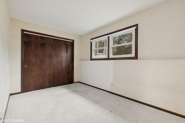 1092 Aberdeen Ln, Mundelein, IL 60060 - unfurnished bedroom featuring light carpet, baseboards, and a closet