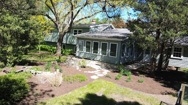1092 Aberdeen Ln, Mundelein, IL 60060 - rear view of house with a patio area, roof with shingles, and a chimney
