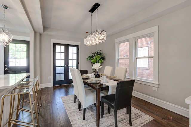 842 Mapleton Ave, Oak Park, IL 60302 - dining space with a chandelier, baseboards, dark wood finished floors, french doors, and a raised ceiling