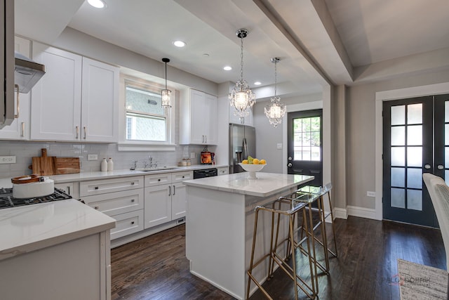 842 Mapleton Ave, Oak Park, IL 60302 - kitchen with stainless steel refrigerator with ice dispenser, a sink, backsplash, dark wood finished floors, and a kitchen breakfast bar