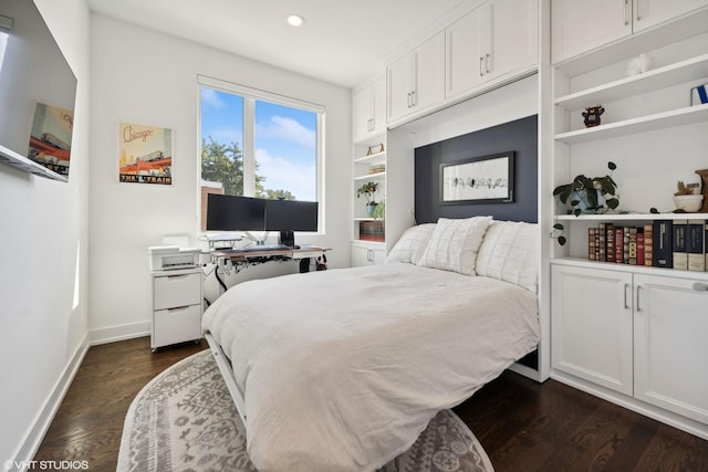 bedroom featuring dark wood finished floors, baseboards, and recessed lighting