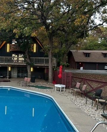 10081 Haas Rd, Rockton, IL 61072 - swimming pool featuring a patio area and a wooden deck