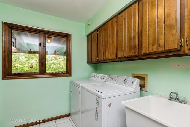38695 N Shagbark Ln, Wadsworth, IL 60083 - laundry room with cabinet space, separate washer and dryer, light tile patterned flooring, and baseboards