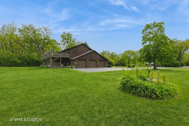 38695 N Shagbark Ln, Wadsworth, IL 60083 - view of grassy yard featuring driveway and a wooden deck