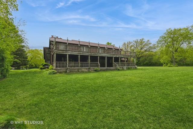 38695 N Shagbark Ln, Wadsworth, IL 60083 - back of house featuring a yard and a wooden deck