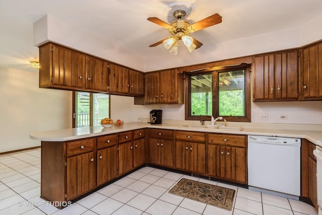 38695 N Shagbark Ln, Wadsworth, IL 60083 - kitchen featuring dishwasher, a sink, a peninsula, and healthy amount of natural light
