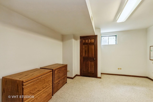 38695 N Shagbark Ln, Wadsworth, IL 60083 - below grade area featuring light colored carpet and baseboards