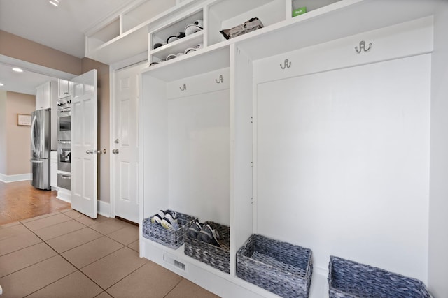 2215 Barger Ct, Wheaton, IL 60189 - mudroom with light tile patterned floors and recessed lighting