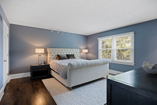 2215 Barger Ct, Wheaton, IL 60189 - bedroom featuring rail lighting and dark wood finished floors