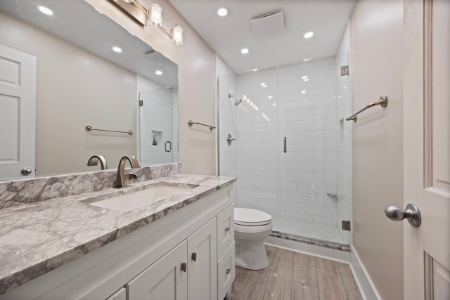 2215 Barger Ct, Wheaton, IL 60189 - bathroom with vanity, a stall shower, wood finished floors, and recessed lighting
