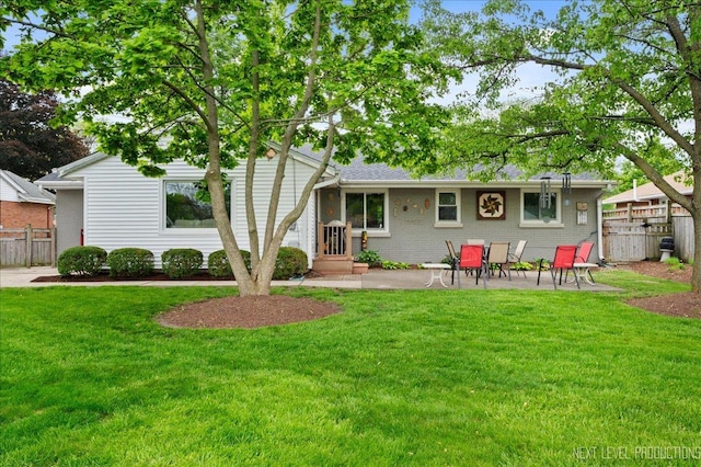 1731 Garfield Ave, Aurora, IL 60506 - rear view of house featuring a patio and brick siding